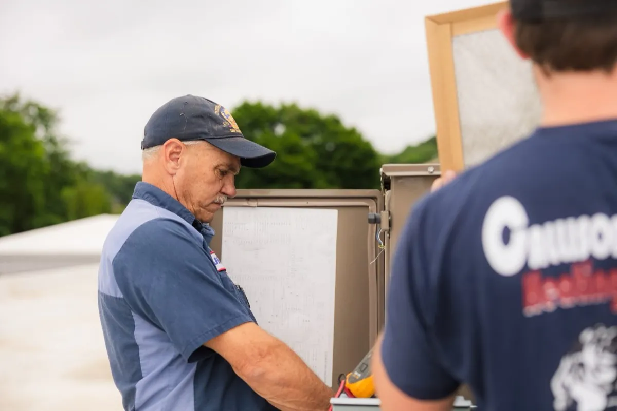 Callison electrician reviewing an electrical schematic during a panel upgrade in Staunton, Virginia