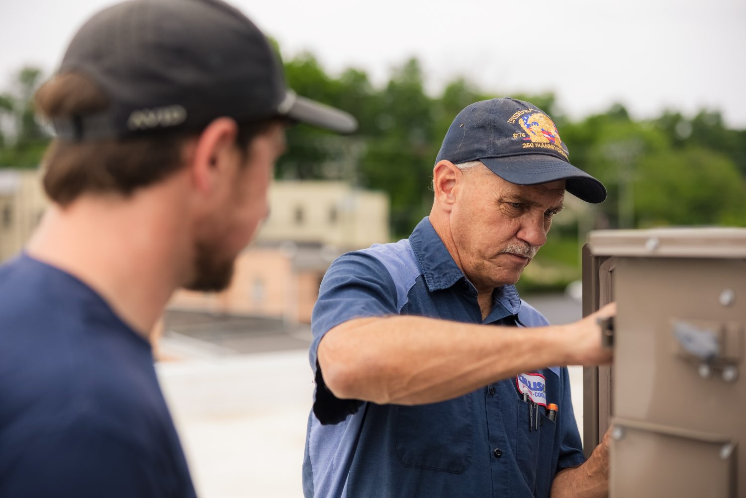 Callison electricians troubleshooting a control panel together in Augusta County, Virginia