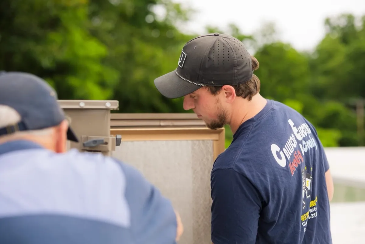 Callison HVAC technicians checking a rooftop air handler in Augusta County, Virginia