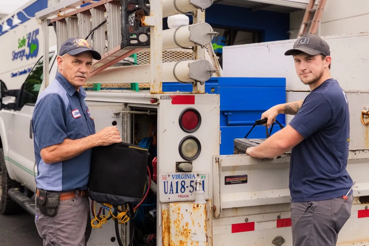 Jimmy and the Callison Electric Heating and Cooling team at their service truck in Staunton, Virginia