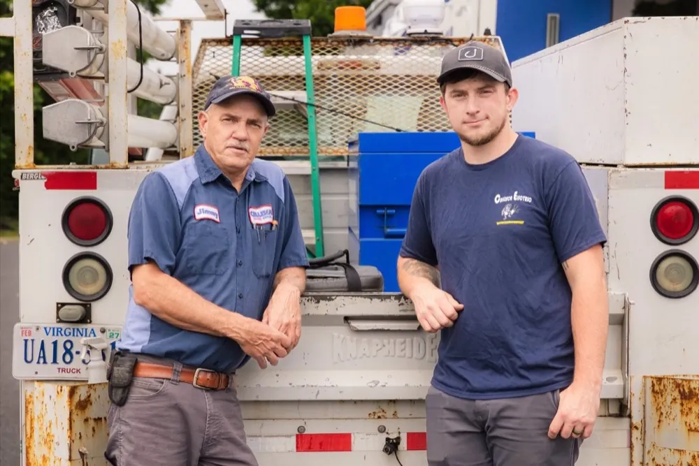 Jimmy and the Callison Electric Heating & Cooling team standing at their service truck in Staunton, Virginia